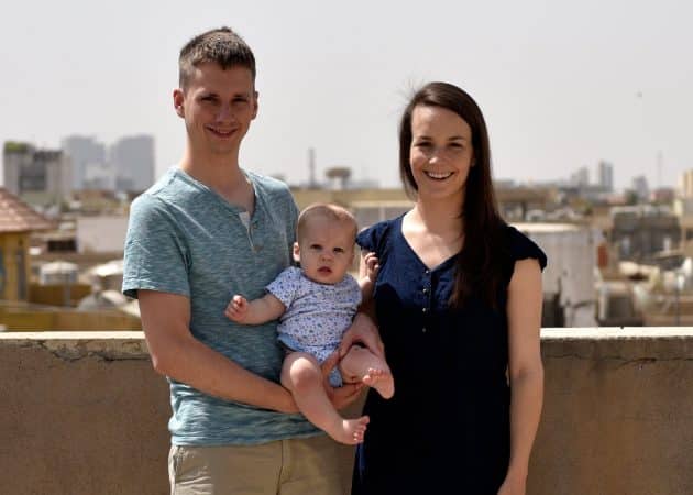 Nathan Hershberger '08, Young Alum of the Year
2018, with his wife Katilin Heatwole and Leo on the roof of their house in Ankawa, Iraq. Photo by Joel Carillett.