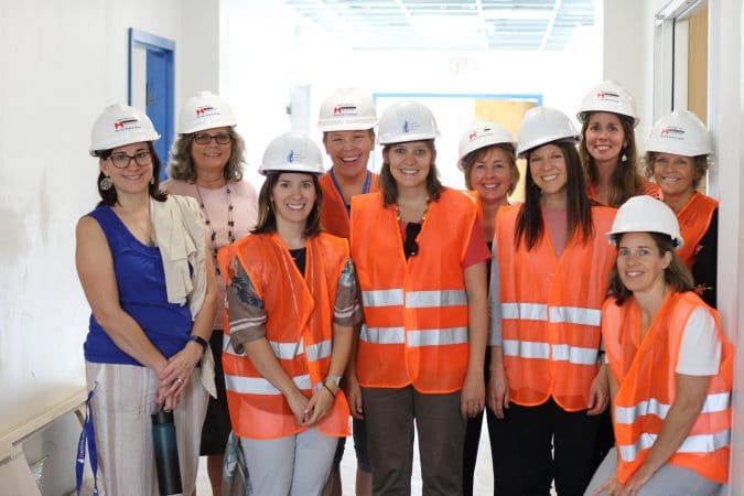 Elementary teacher and staff get a look at EMES building renovations. Left to right: Jen Stoltzfus (office manager), Maria Archer (principal), Erika Gascho (5th grade), Heidi Byler (3rd grade and administrative leader), Hannah Bailey (1st grade), Susan Stoltzfus (2nd grade), Erin Williams (art teacher and K assistant), Emily Moyer-Warren (reading specialist), Lynette Mast (K) and Gini Trotter (front, peacebuilding, garden and counseling services)