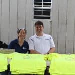 Shannon and Brandon Roth manage T-shirt sales at the 2019 EMHS cross country invitational.