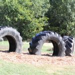 Eighth grade science class works on EMES playground tire project.