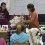 Learning about quilts from area experts on History Day for the centennial quilt project