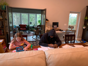 Chad Seibert, boys varsity basketball coach and PE teacher, shared a picture of home school at his house, including his daughter and Aviwe Mahlong, host son.