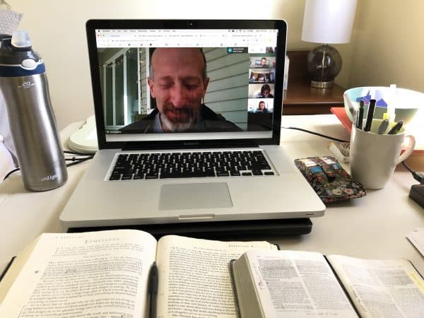 Curt Stutzman, assistant girls varsity soccer coach, leads prayer for team's virtual Bible study