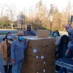 Staff at Capital Christian Fellowship unload MCC food boxes, provided by EMS. Pastors Glenn Kauffman and Akeia Haddox-Rosssiter on the right. 