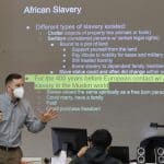 Justin King, high school principal and former history teacher, teaches African-American history class, a new elective this spring
