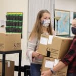 Halie Mast and Karla Hostetter move boxes for the National Honor Society food drive, fall 2020.