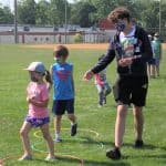 Eighth grade helps with games at elementary field day