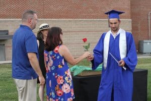 Mike and Jen Stoltzfus (director of operations, EMES office manager) greet their son, Luke, commencement 2021