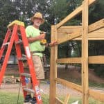Kendal Bauman begins to build a climbing wall for the elementary playground