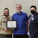 Representatives from the Boy Scouts of America Massanutten District present award to Kendal Bauman