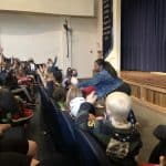 Elementary students eagerly shared answers to Moore's questions during Gathering