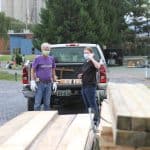 Ethan Zook '72 and Hannah Hendricks '22 consult on the outdoor set build for Les Mis, fall 2020