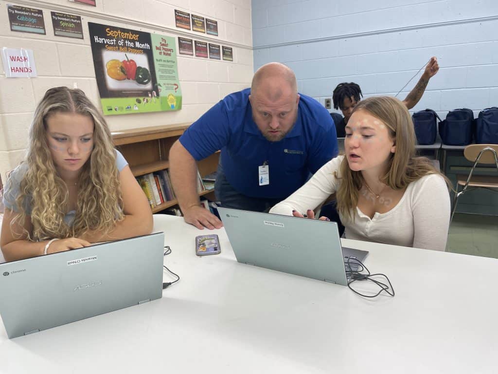 Charles Hendricks, Gaines Group Architects, helps students with design projects