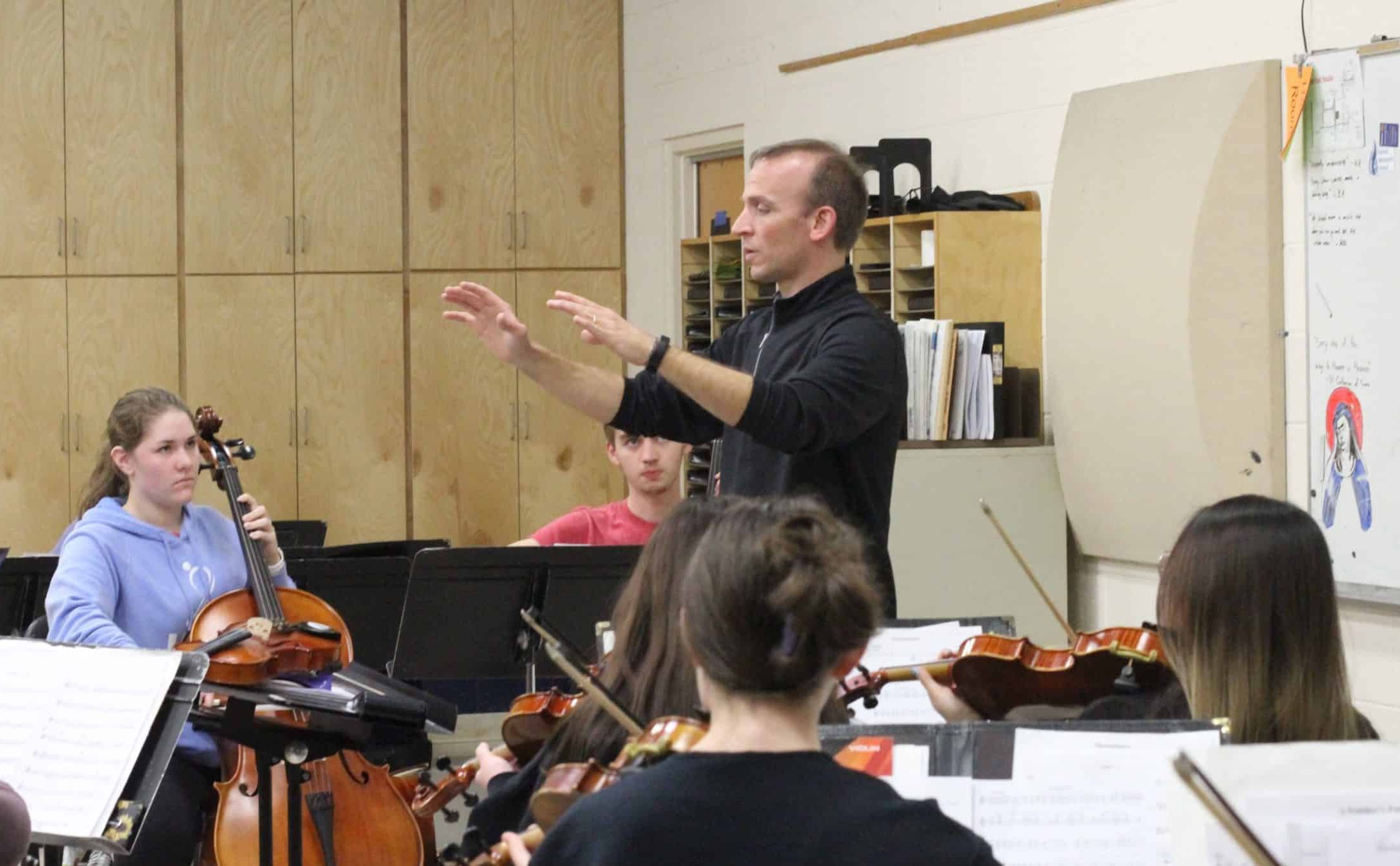 Joel Ross '01 was a guest strings conductor for a spring 2023 orchestra festival at EMS