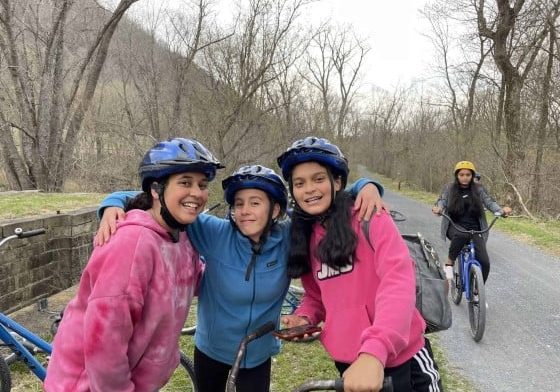 Girls pause for photo on bike trail